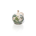Decorative ceramic apple ornament with gloss cream finish, green and blue vintage floral pattern, and rustic stem