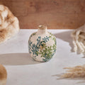 Bulbous stoneware vase with narrow neck, cream glaze, green and blue vintage floral pattern, and crackle finish