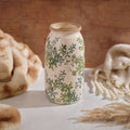 Tall cream stoneware ceramic vase featuring glossy finish, vintage green and blue hand-painted floral pattern, and weathered rim